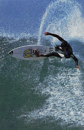 A picture of Skeetre surfing the waves at North Shore 
(his own personal beach) near his Surf Shop at the Tropical Beach.